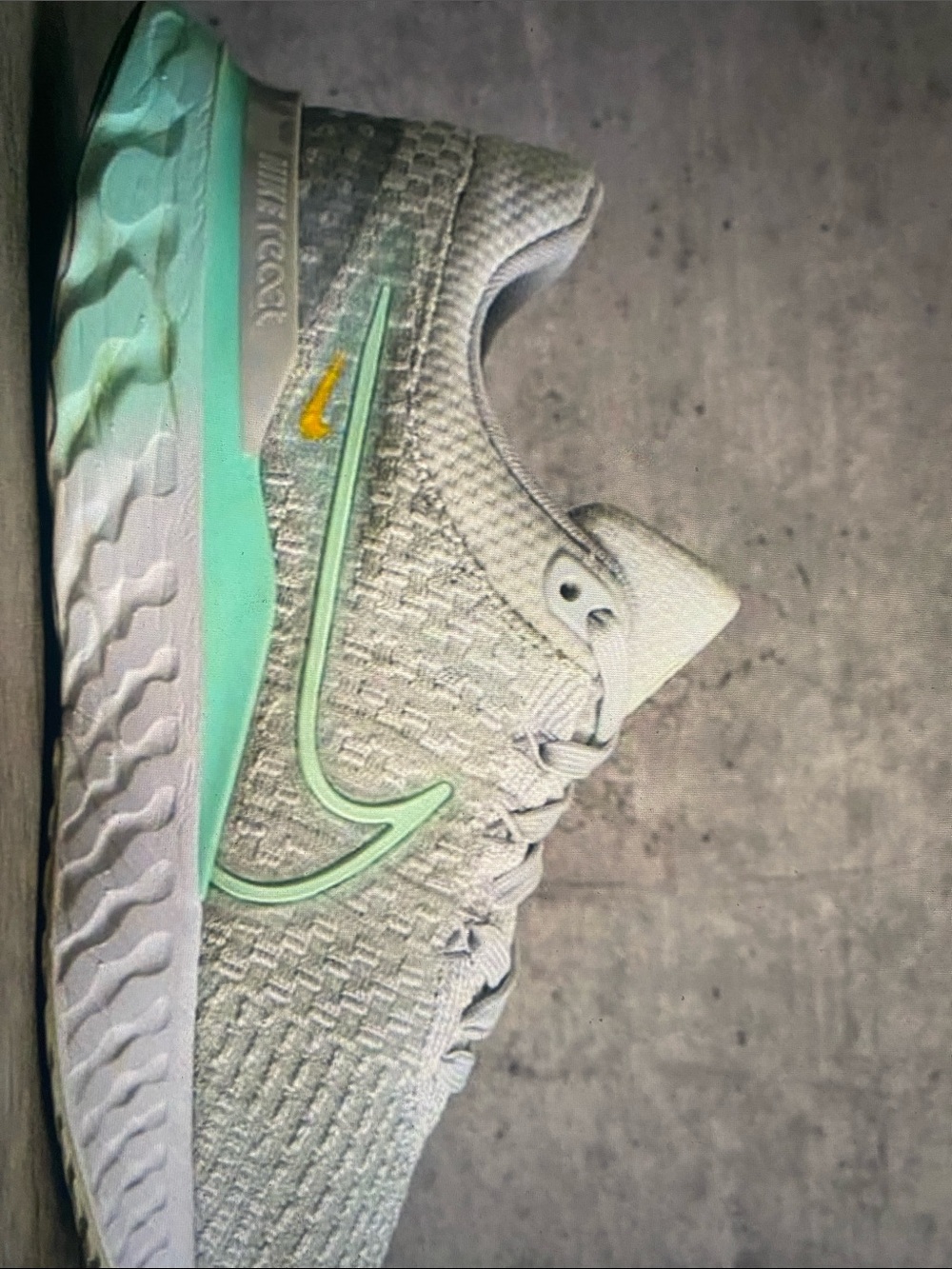 Nike Women's Running Sneaker in Light Gray with Mint and Yellow Accents